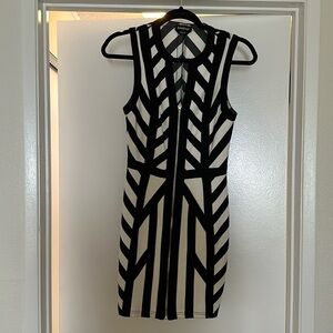 Black and white Bebe dress with a front zipper